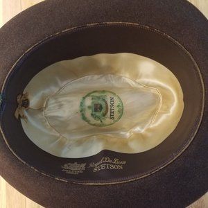 Men's Brown rimmed stetson with braid.